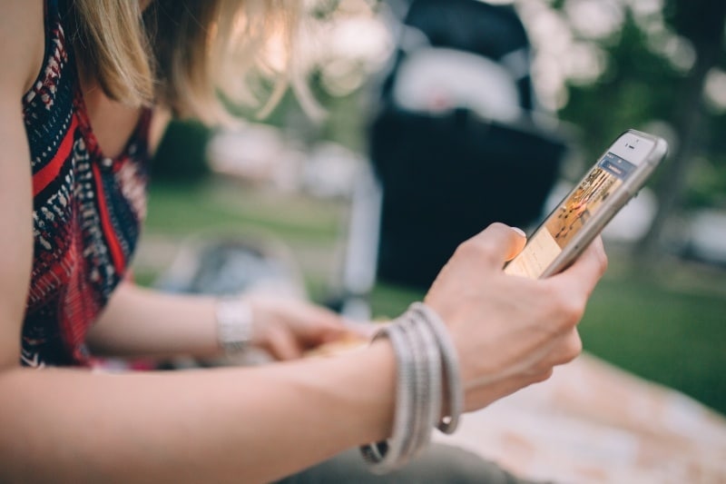 Image of woman looking at an image on her phone